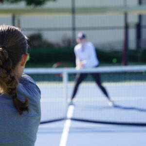 NMBA junior female tennis player training North Miami Beach Academy high-performance