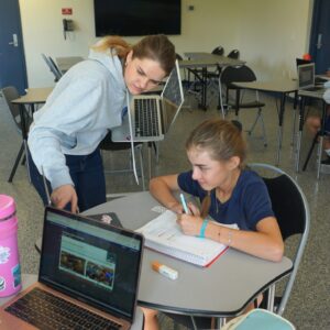 North Miami Beach Academy student and teacher working at laptop close up K-12 academic program
