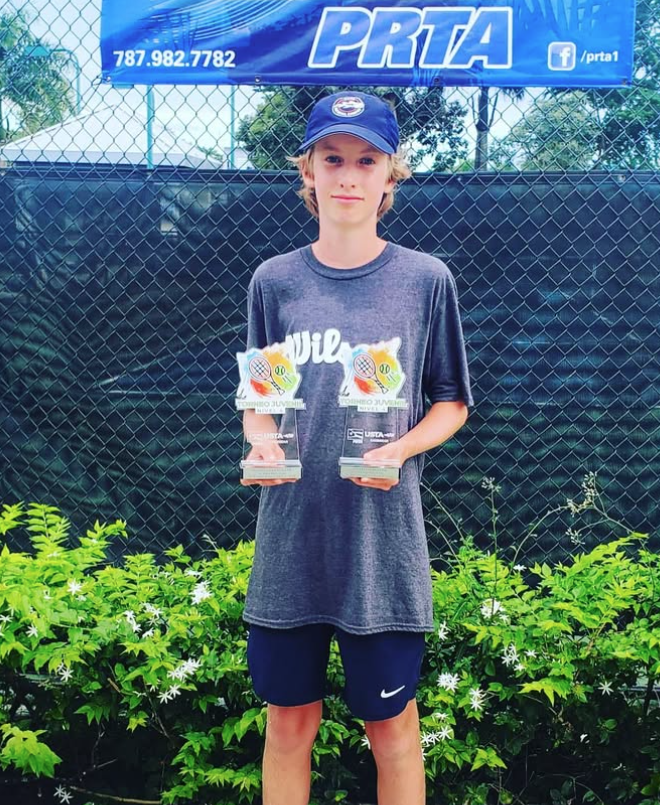 Santiago celebrating tournament win — NMBA junior tennis champion