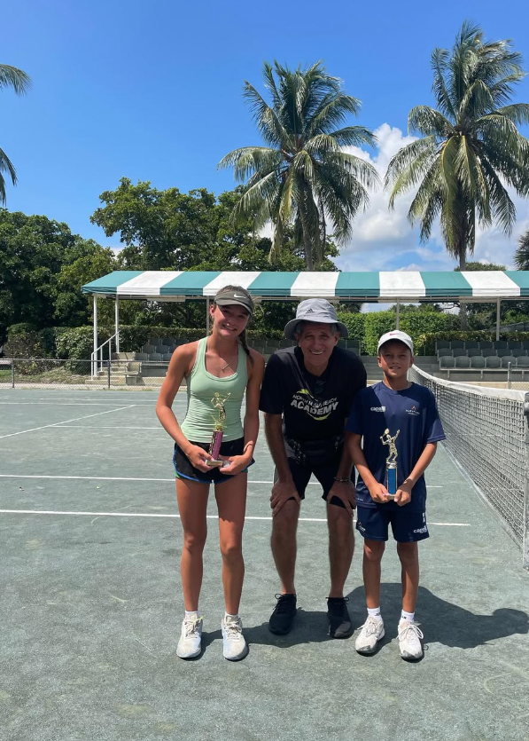 Quinn and Illia celebrating doubles tournament win — NMBA junior tennis champions