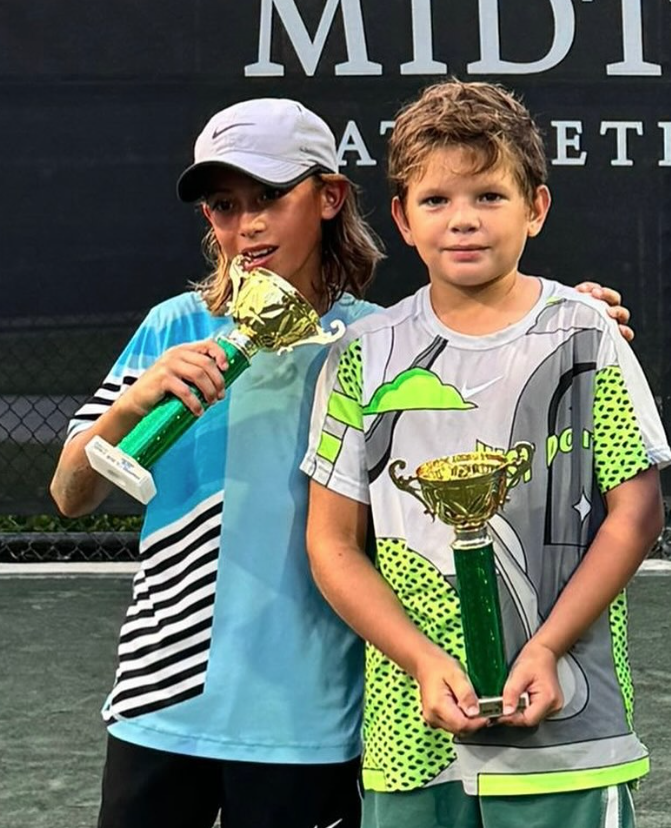 Lorenzo Tovar with tournament trophy — NMBA junior tennis champion